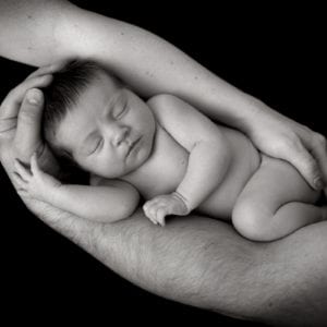 Black and white newborn baby photography newborn photography in parents hands newborn photoshoot in black and white