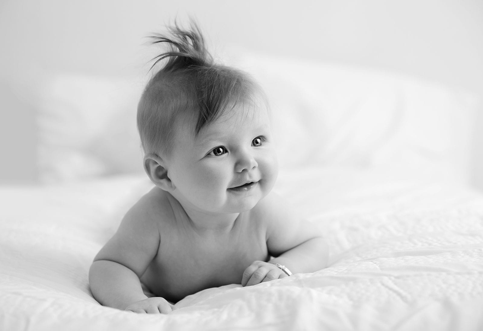 Baby photographed with sticking-up hair